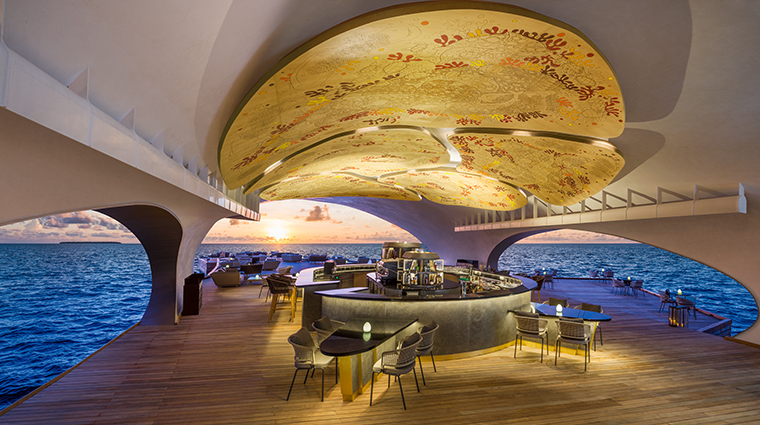 the st regis maldives vommuli resort mural and bar